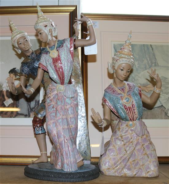 A Lladro enamelled stoneware group of Thai dancers & another figure